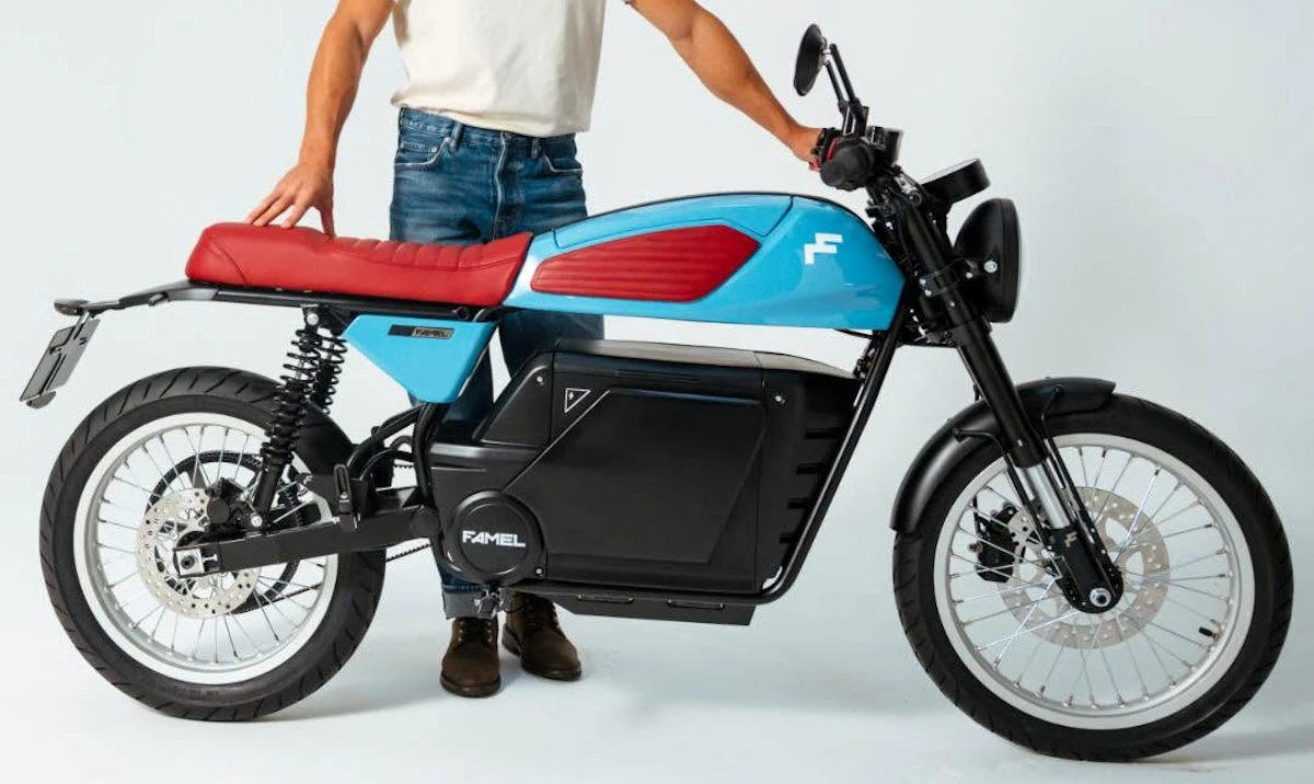 A red Famel E-XF Café Racer motorcycle