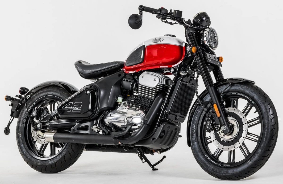 A red and white Jawa 42 Bobber motorcycle