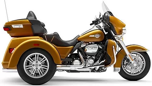 Foto de perfil del 1870 Tri Glide Ultra FLHTCUTG 2023 en color amarillo.