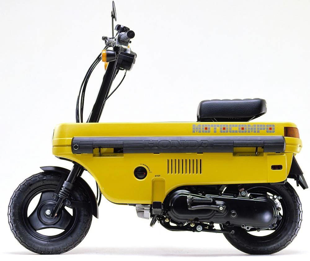 Photo de profil de la Motocompo 1981 en couleur jaune