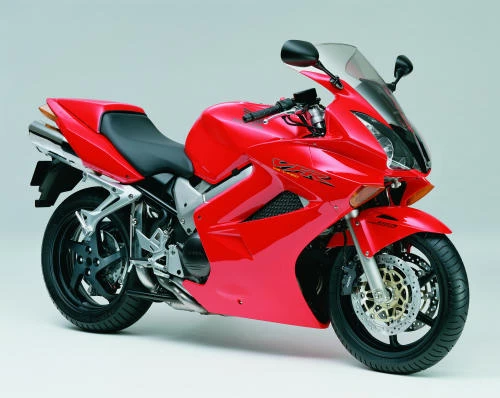 Foto de perfil del VFR 800 V-TEC  RC 46 II 2002 en color rojo.