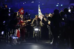 Closing the 2024 Olympics: Tom Cruise in Olympic form, on a motorcycle