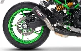 An SC-Project exhaust made of TI-Carbon, a green wheel, a slightly extended rear end, a yellow Öhlins shock absorber, and the rear section of a Kawasaki Z900SE motorcycle