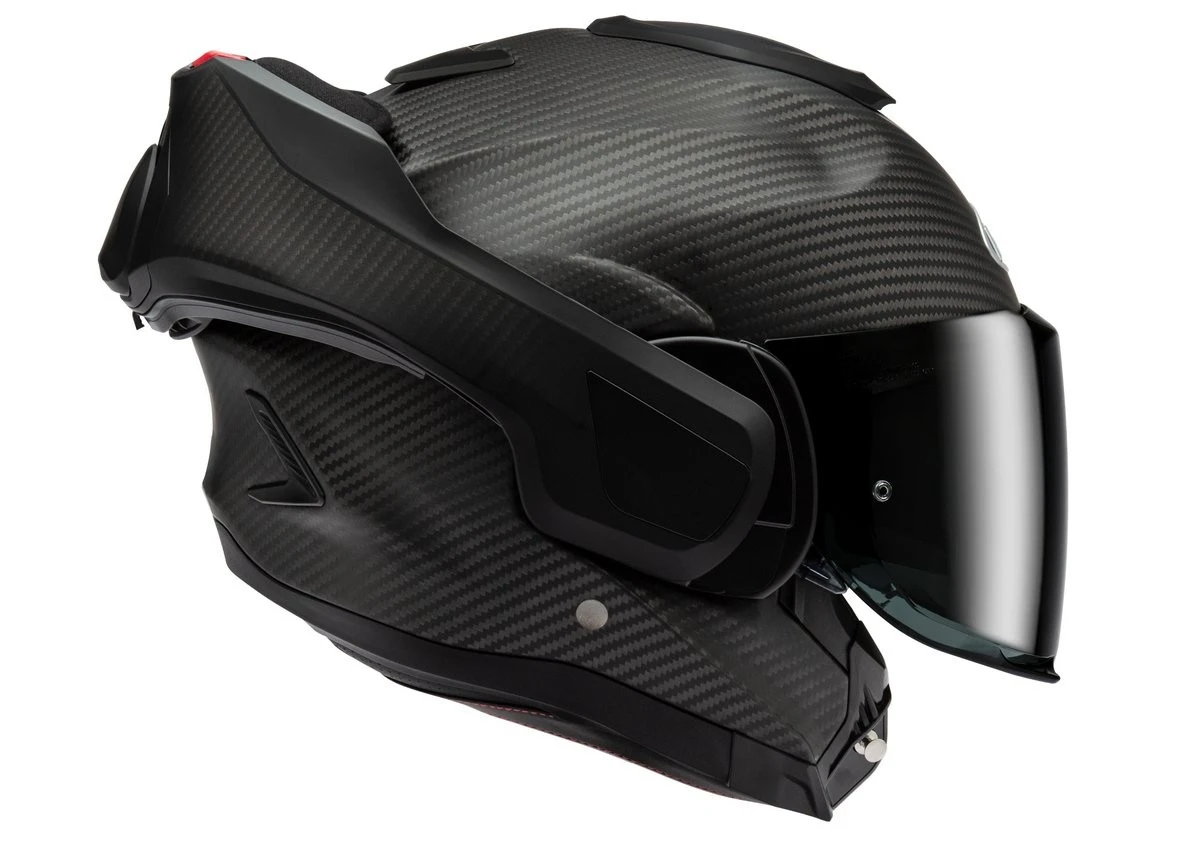 Un casque modulable HJC F 100 Carbone mat en position ouverte.