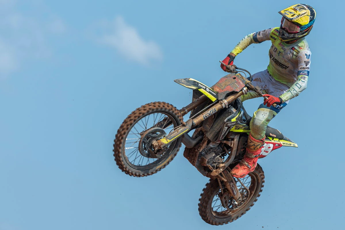 Guillem Farres taking a jump on his Triumph TF 250-X under a blue sky
